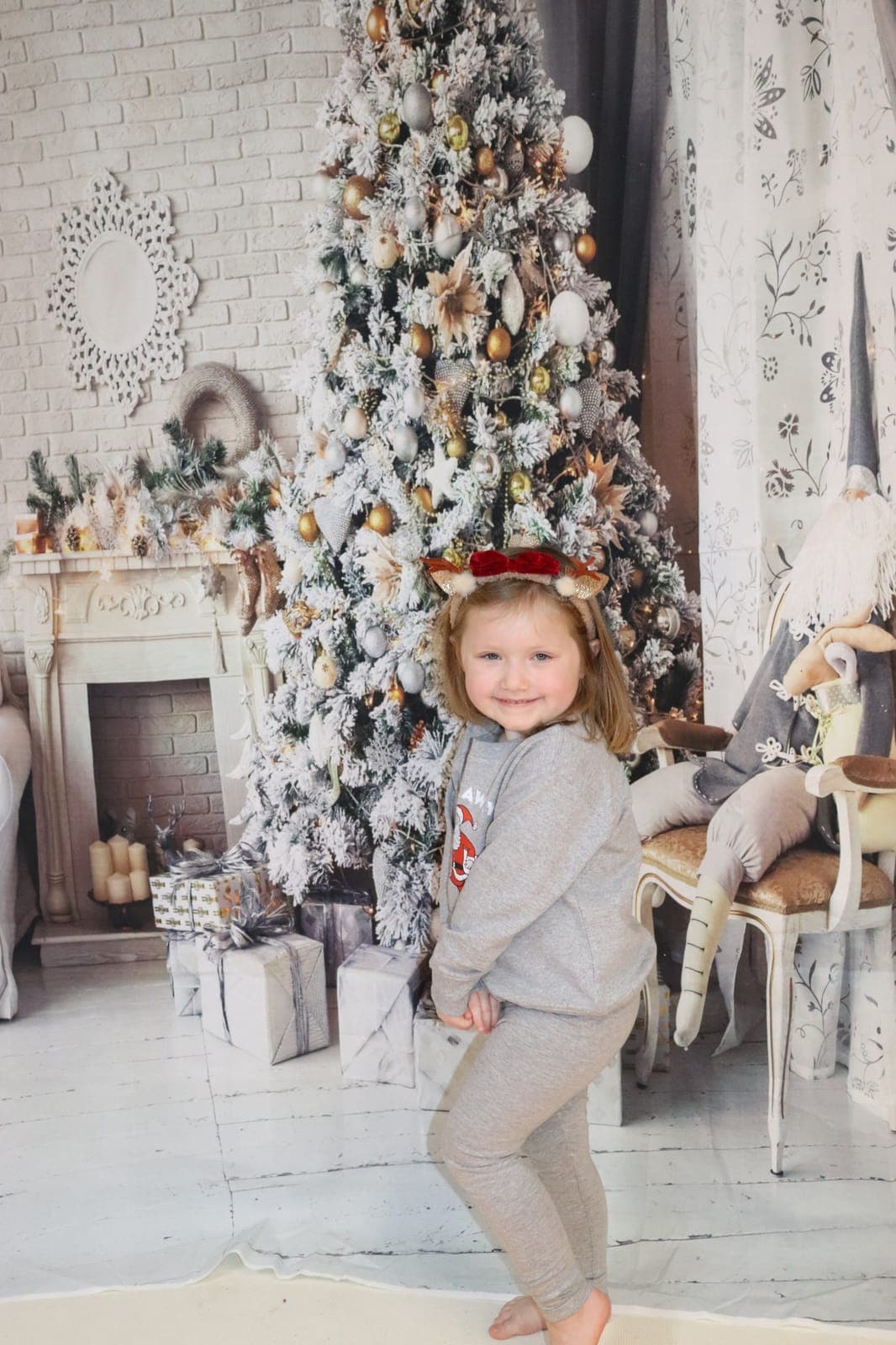 Three kids enjoying a ride together on a red rocking toy